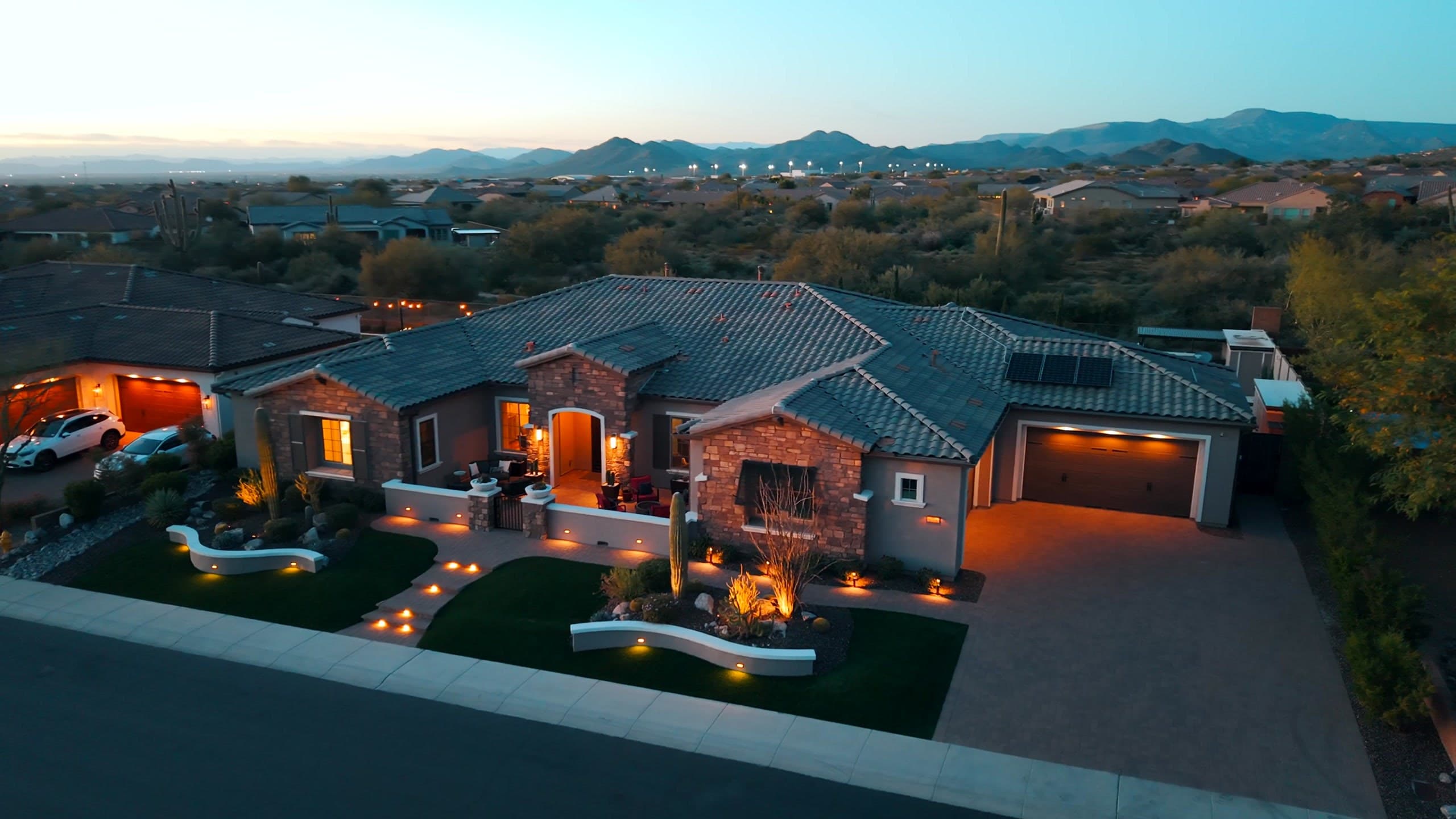 Desert-modern estate at dusk in the Cave Creek foothills