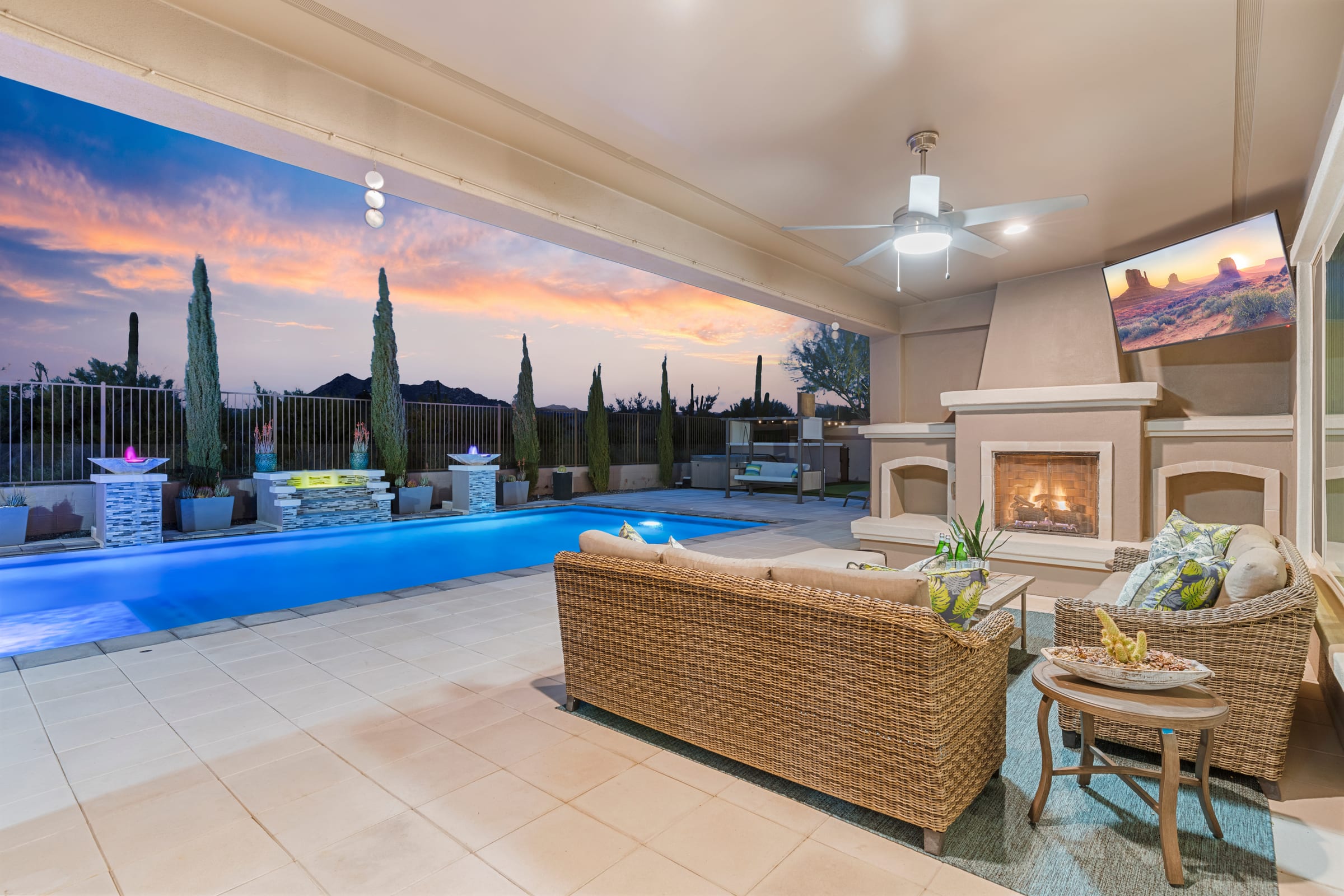 Covered patio and pool terrace at dusk