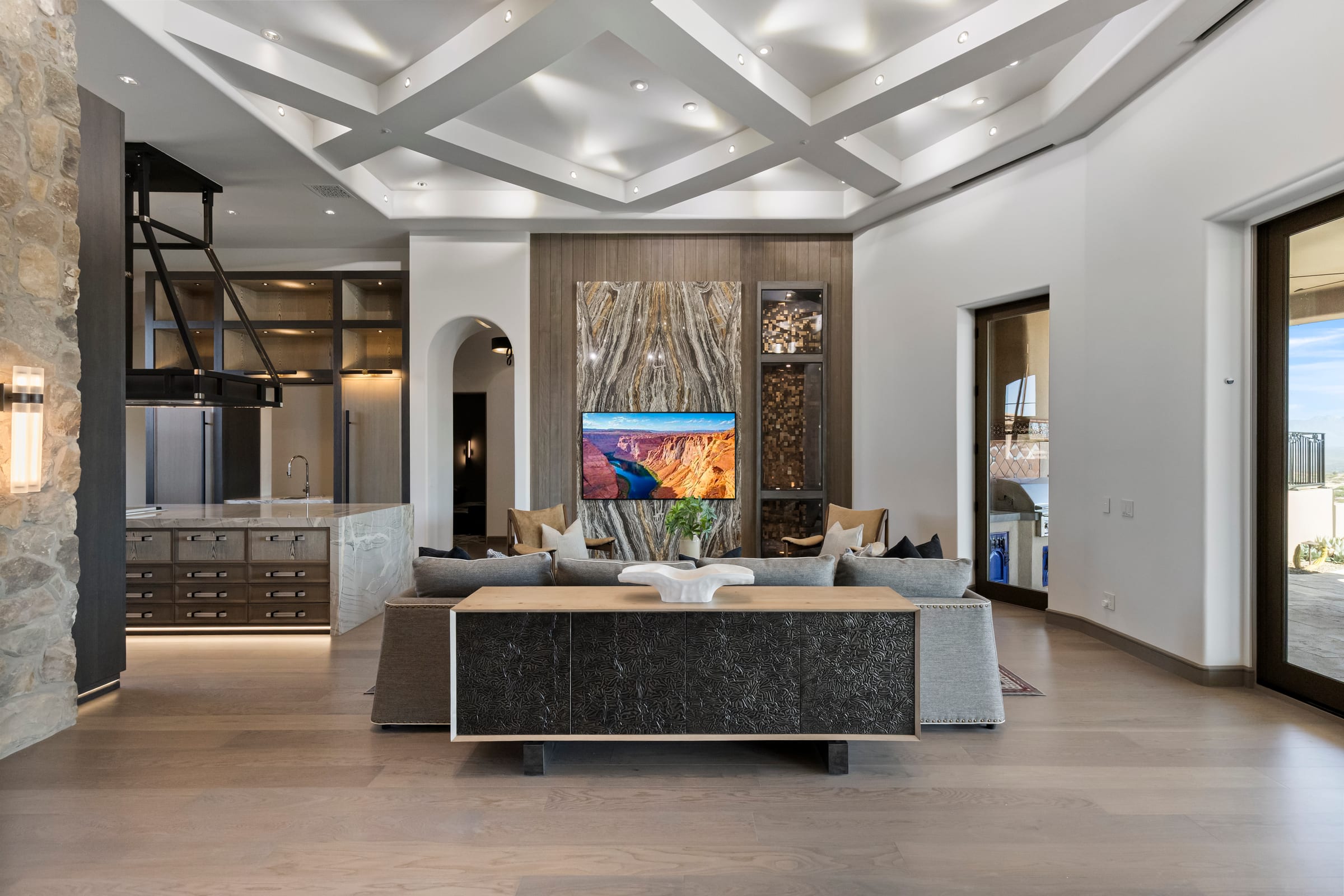 Great room staged and prepared for market, opening to the desert