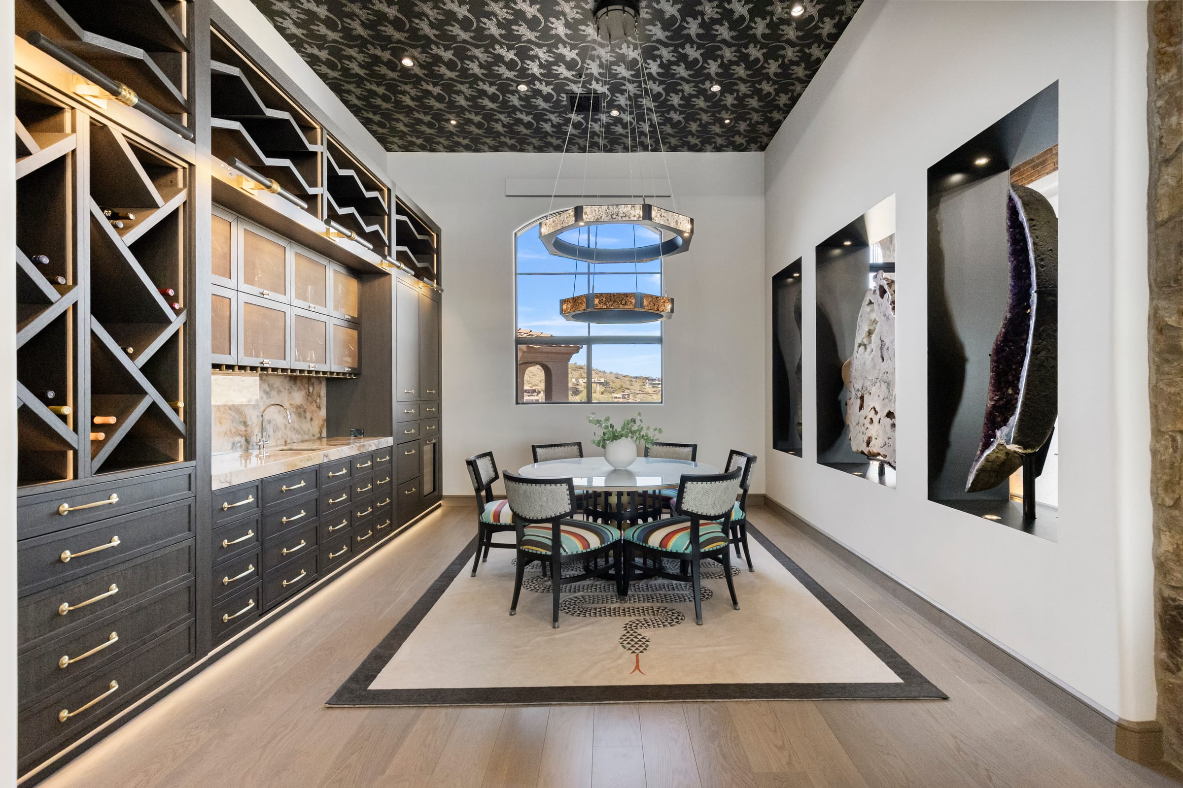 Dining room styled against a glass wine wall